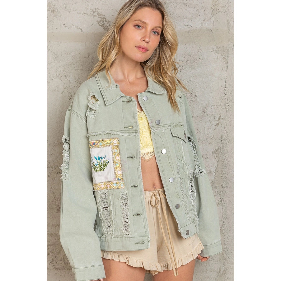 Patch Work Distressed Jacket - Dusky Sage Oversize Patch Work Panel Distressed Shacket Designed in an oversize fit Patch work panel detailing in distressed details Button down shacket 100% Cotton Color: Dusky Sage This Patch Work Distressed Jacket is the perfect way to show off your unique sense of style. Crafted from high-quality materials and featuring a distinctive patchwork design, this jacket is designed for long-lasting wear. Look effortlessly cool and comfortable in this dusky sage color.