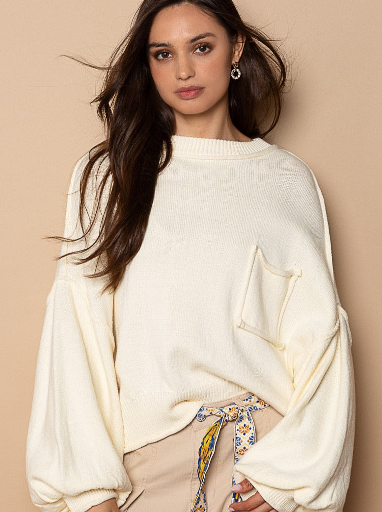 Brittany Balloon Sleeve Pullover Designed in round neck line Balloon sleeve Relaxed fit with rolling edge detail Featured in acrylic hacci pullover sweater Specs/Dimensions: - LENGTH: 22" - BUST: 24" 100% Cotton Color: Cream This stylish Brittany Balloon Sleeve Pullover is perfect for any wardrobe. Crafted from a lightweight material, it boasts a flattering balloon sleeve silhouette, making it the perfect addition to your casual or workwear repertoire.