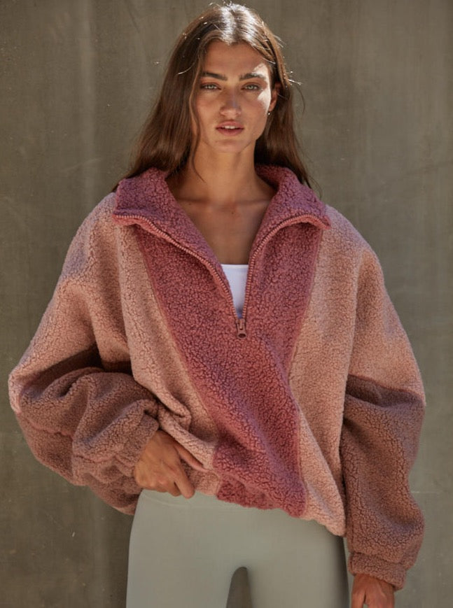 Sugar Rush Ride Half Zip Woven Polyester Sherpa Half-Zip Collar Neck Long Sleeve Pullover Top With Lining 100% Polyester Color: Mauve Multi The Sugar Rush Ride Half Zip is the perfect companion for chilly weather. Its mauve sherpa fabric provides warmth and comfort, making it ideal for outdoor activities. Its sleek half-zip design offers a modern look while still keeping you warm and cozy.