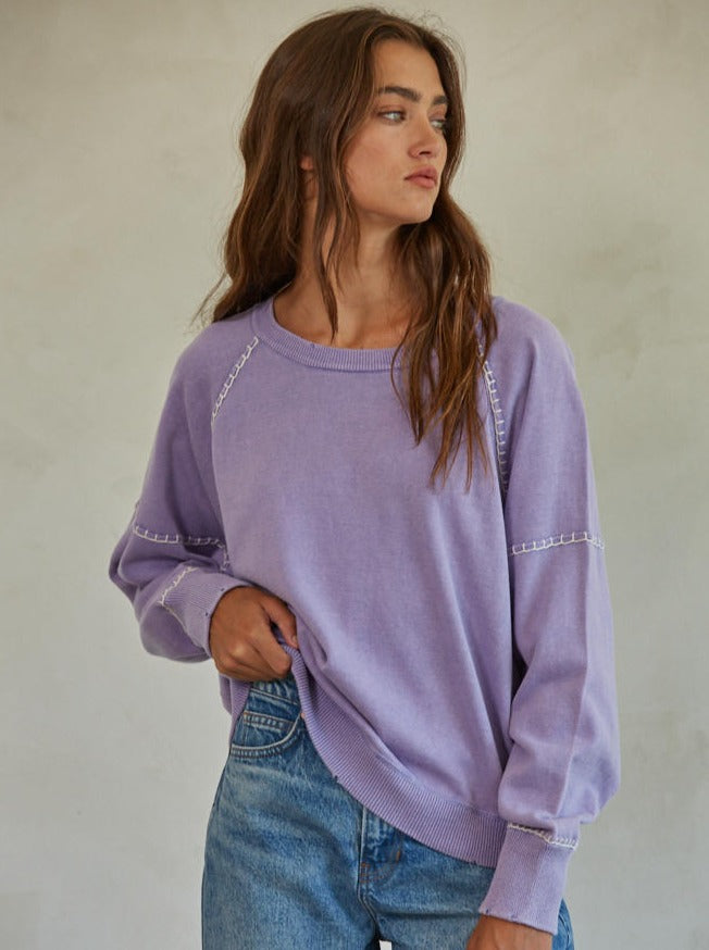 Franky Sweater Cotton Knit Round Neck Long Sleeve Stitch Detail Sweater Top 100% Cotton Color: Pale Green and Dark Lavender The Franky Sweater features a classic crew neck design that is timeless and versatile. Its lightweight, breathable fabric makes it perfect for any season and occasion. The sweater is durable making it a great addition to any wardrobe.