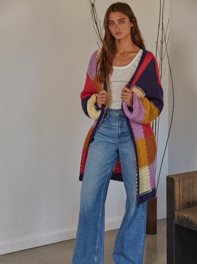 April Bliss Cardigan Knit Acrylic Sweater Color Blocking Crocheted Open Front Long Sleeve Oversized Cardigan With Side Pockets 100% Acrylic Color: Navy Multi This April Bliss Cardigan is a colorful crochet masterpiece. Its luxurious design is sure to make a statement. It features intricate knitting and is made from quality materials. Let the April Bliss Cardigan add a bright and stylish touch to your wardrobe.