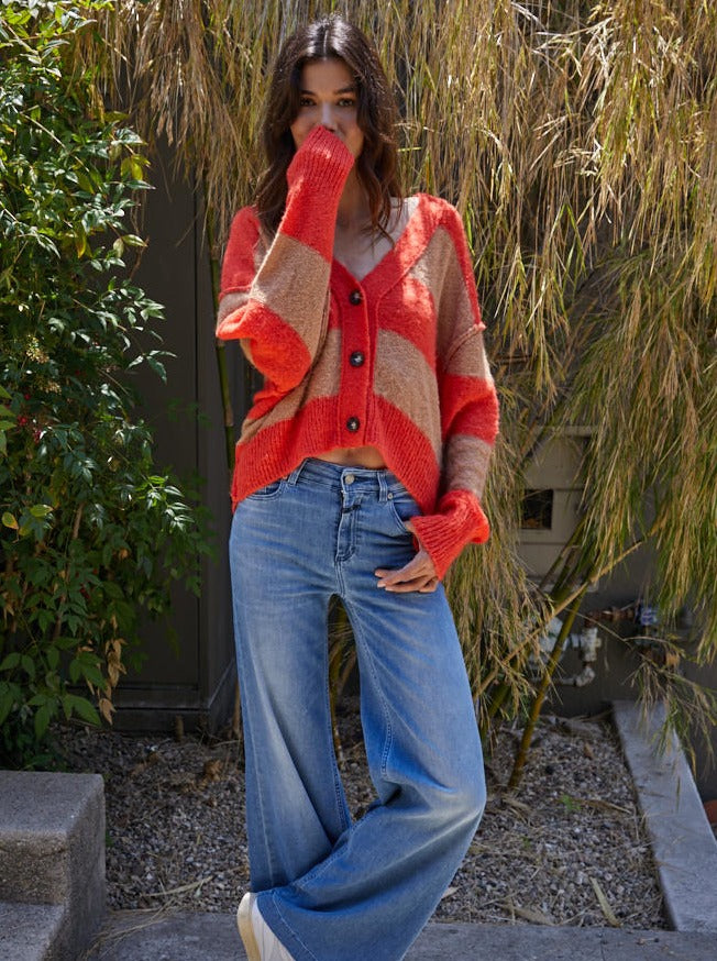 Izzy Striped Cardigan Knit Sweater Stripe V-Neck Button Down Long Sleeve Cardigan 68% Acrylic, 22% Nylon, 10% Alpaca Color: Coral Mocha The Izzy Striped Cardigan features a classic striped design and a button-up front. This timeless style can be worn for a variety of occasions, from casual to dressy. Made from a soft, comfortable fabric, you get stylish warmth without sacrificing breathability