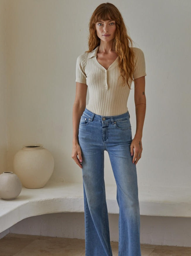 Call Me Maybe Top Knit Viscose Spandex Sweater Ribbed Button down Collar V-Neck Short Sleeve Pullover Top 75% Viscose, 25% Spandex Color: Tan Be sophisticated and stylish with the Call Me Maybe Top from our new collection. Crafted from a soft, breathable material, this short sleeve button down sweater top is perfect for any occasion. With its comfortable fit and classic design, you're sure to stand out in any room.