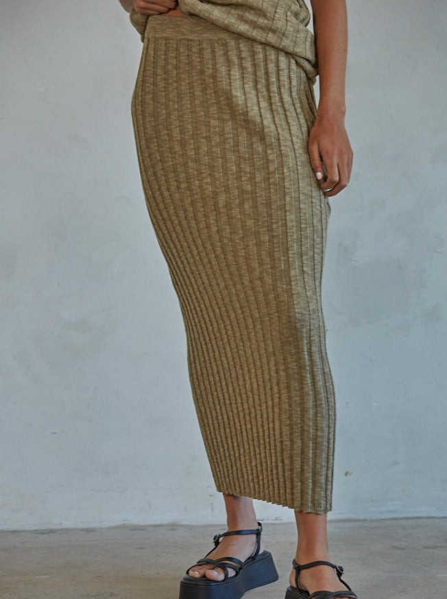 The Isla Skirt is a stylish and sophisticated midi skirt, crafted with ribbed fabric that creates a flattering, figure-hugging silhouette, perfect for day-to-night outfits. The fabric is super lightweight and breathable, allowing you to look your best all day long.