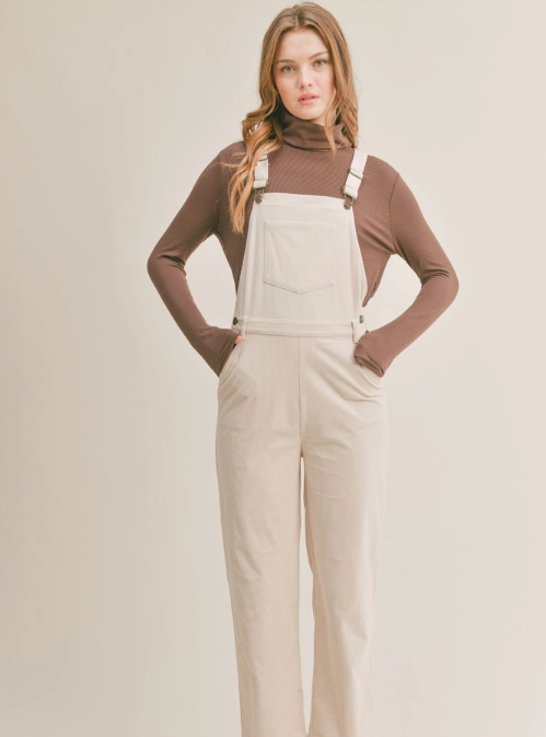 Nomad Corduroy Overalls Corduroy overalls Pockets 100% Polyester Color: Cream The Nomad Corduroy Overalls will keep you stylish and comfortable all day long. Made from a durable corduroy fabric, these overalls are perfect for everyday wear. They provide a great combination of both breathability and protection from the elements. With a timeless silhouette, they are sure to become a staple in your wardrobe.