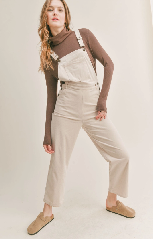 Nomad Corduroy Overalls Corduroy overalls Pockets 100% Polyester Color: Cream The Nomad Corduroy Overalls will keep you stylish and comfortable all day long. Made from a durable corduroy fabric, these overalls are perfect for everyday wear. They provide a great combination of both breathability and protection from the elements. With a timeless silhouette, they are sure to become a staple in your wardrobe.