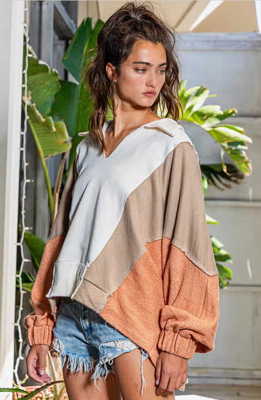 Outbound Oversized Contrast Top Oversized Spread Collared V-Neck Contrast Top French-terry cotton fabric Spread collared V-neckline Contrast raw edge detail Elastic cuffs Oversized fit 74% Cotton, 26% Polyester Color: Cream/Taupe/Salmon