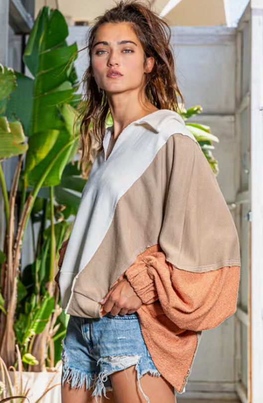 Outbound Oversized Contrast Top Oversized Spread Collared V-Neck Contrast Top French-terry cotton fabric Spread collared V-neckline Contrast raw edge detail Elastic cuffs Oversized fit 74% Cotton, 26% Polyester Color: Cream/Taupe/Salmon
