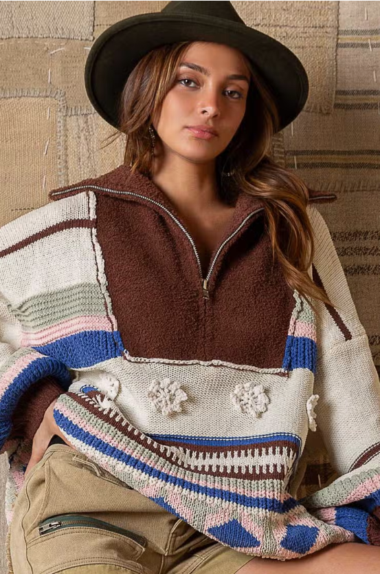 Jade Half Zip Sweater Designed in half zipper front High collar Balloon long sleeves Oversized fit Outseam edge and patch details Ethnic patterned color block Chenille pullover sweater Specs/Dimensions: - BUST: 27" - LENGTH: 24-1/2" - SLEEVE: 15-3/4" - SHOULDER: 25" 100% Polyester Color: Cream Multi This Jade Half Zip Sweater has a vintage design with a half zip closure. The sweater is made from a soft, lightweight fabric for ultimate comfort and warmth. Perfect for your active lifestyle.