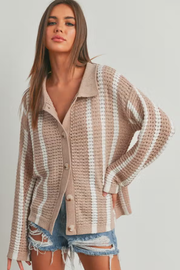 Stacey Stripe Sweater Oversized chenille sweater cardigan Collar Stripe Design Button Up Details 100% Polyester Color: Multiple Introducing the Stripe Oversized Sweater Cardigan - your new favorite companion for chilly days and cozy nights. This exquisite cardigan blends comfort, style, and versatility to create a wardrobe essential that will quickly become your go-to piece.