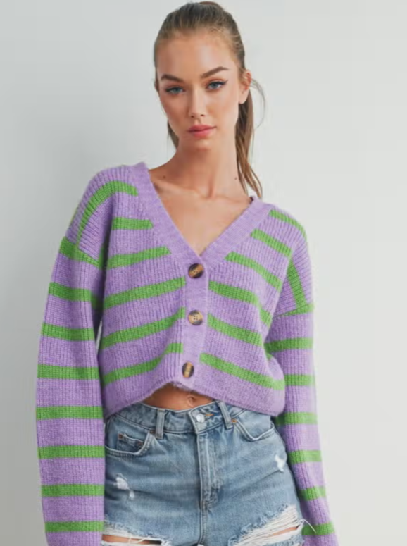 Freddy Fall Stripe Cardigan Button up cardigan Stripe Details 75% Acrylic, 25% Nylon Color: Purple/Green Introducing our captivating Stripe Color Block Crop Cardigan, a versatile and chic addition to your wardrobe. Designed to seamlessly blend comfort, style, and a playful pop of color, this cardigan is a true fashion statement for any season.