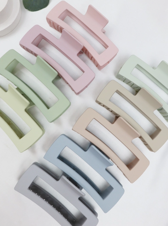 Matte Jumbo Cut Out Rectangle Hair Claw Size: Size: 5 x 2.2 Inch Color: Multiple Our Matte Jumbo Cut Out Rectangle Hair Claw are designed to securely hold your hair in place with a comfortable and stylish finish. These claw clips come in a selection of stunning aesthetic colors, perfect for any look. Get the perfect hold for any hairstyle!
