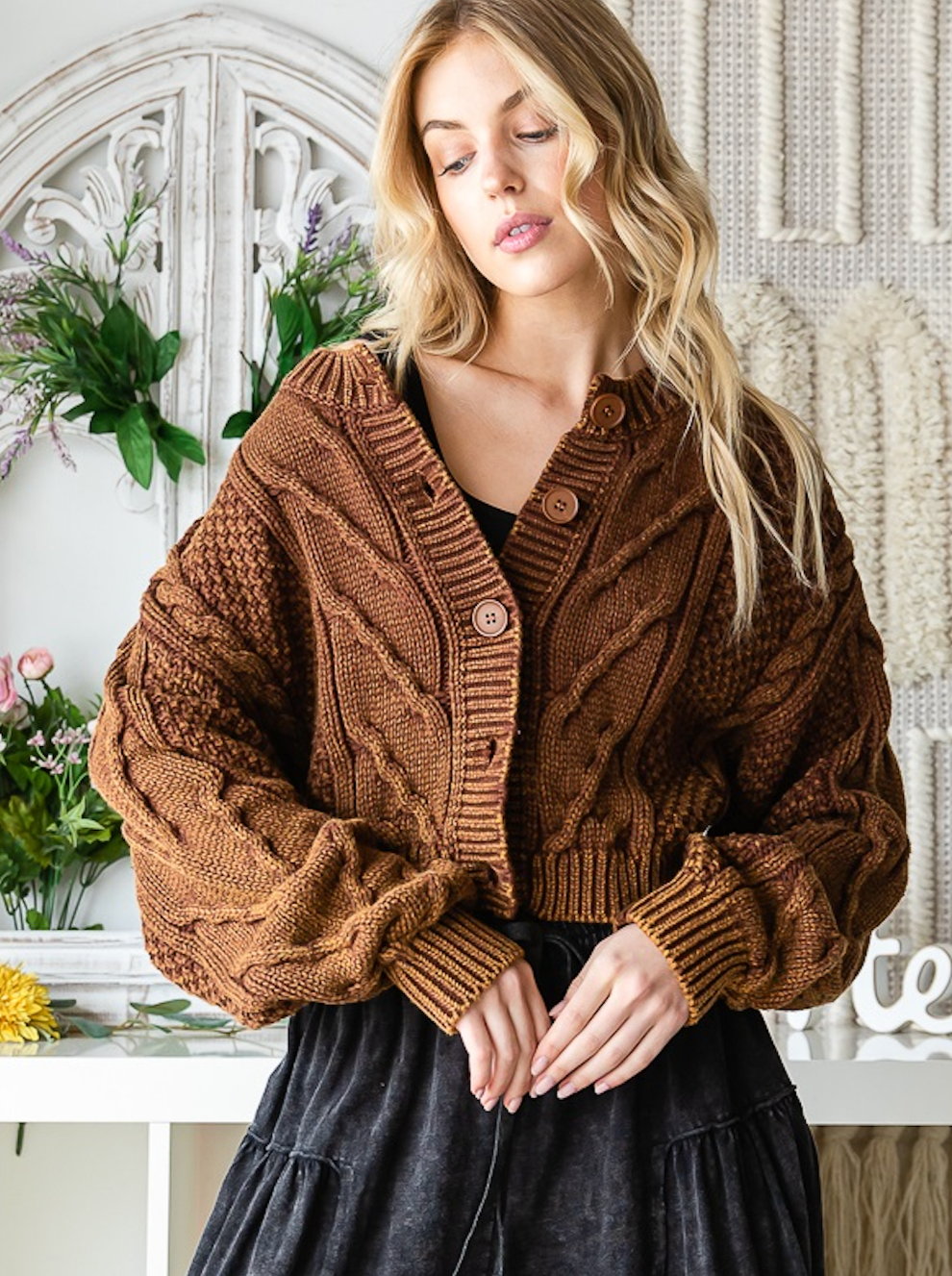 Whitney Washed Sweater Washed Sweater Cardigan Button Up Details Relaxed Fit Color: Brown Our Whitney Washed Sweater is crafted with luxurious cable knit details and a warm brown hue to ensure elegance and comfort all season long. The button-up cardigan provides a timeless silhouette for any style.