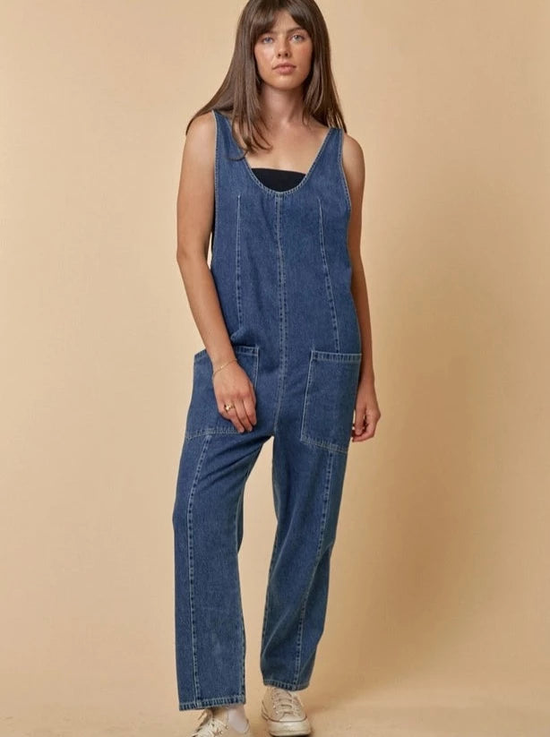 Denim Days Sleeveless Jumpsuit Denim jumpsuit Scoop neckline Sleeveless 90% Cotton, 10% Polyester Color: Denim This Denim Days Sleeveless Jumpsuit is perfect for any occasion. Crafted from lightweight denim, it features a sleek, sleeveless design for a contemporary look. Its relaxed fit and added pockets make it comfortable and practical all-day long.