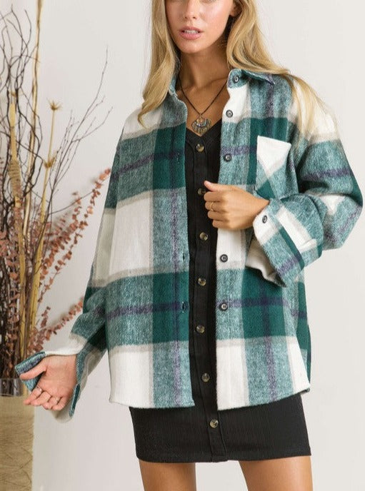 We The Free Plaid Shacket Plaid Long Sleeve Button Down Plus Size Available 100% Polyester Color: Navy, Hunter Green This We The Free Plaid Shacket is perfect for adding a laid-back vibe to your wardrobe, with a stylish plaid pattern. It features a lightweight, button-down design, making it a comfortable choice for any season.