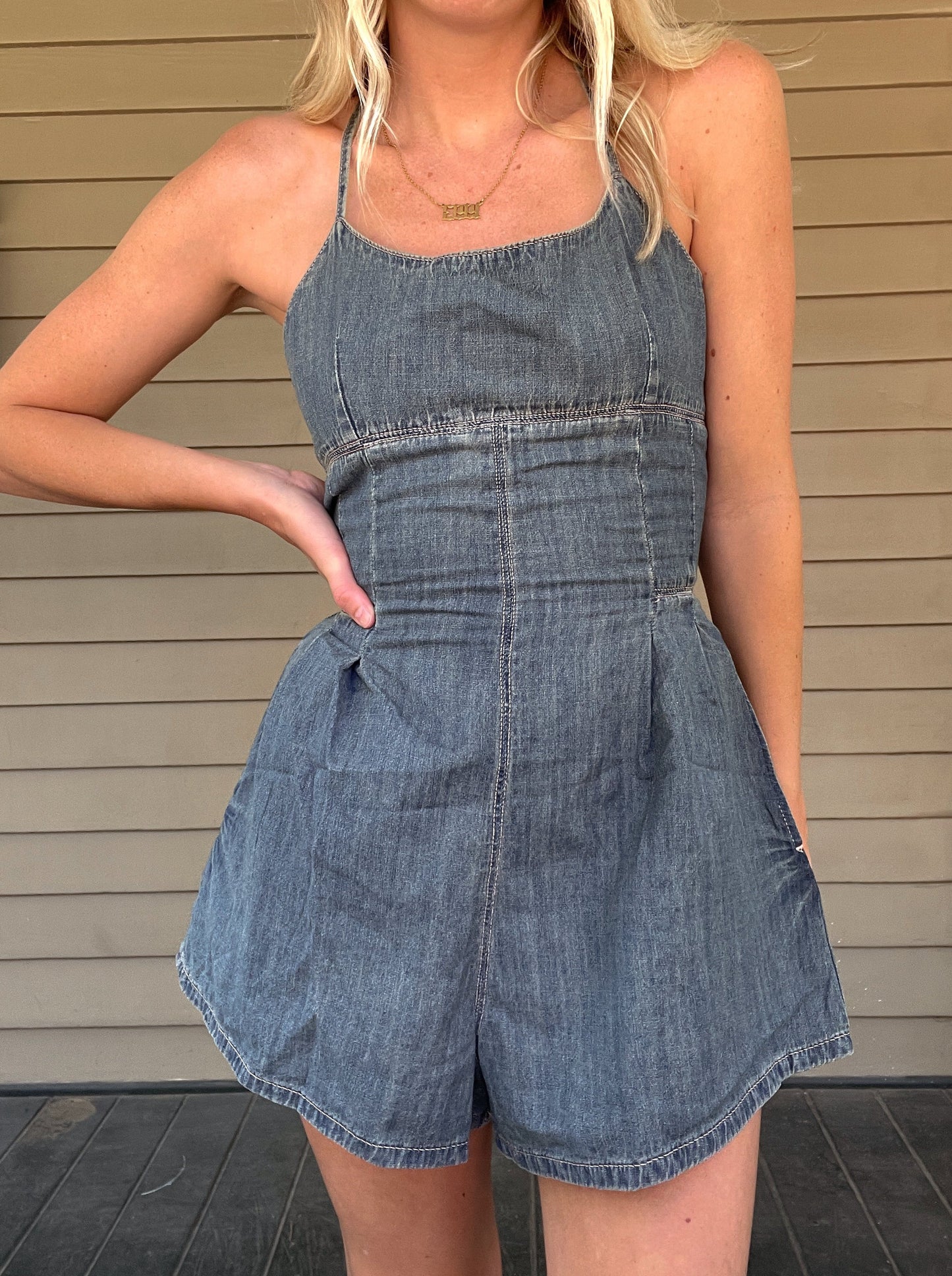 Western Washed Denim Romper Denim Romper Zipper Pockets 100% Cotton String detailed back Color: Washed Denim This Western Washed Denim Romper will have you feeling stylish and comfortable. Made of premium denim, it provides a snug fit and is designed for easy movement. Enjoy taking on the day in this fashionable romper.
