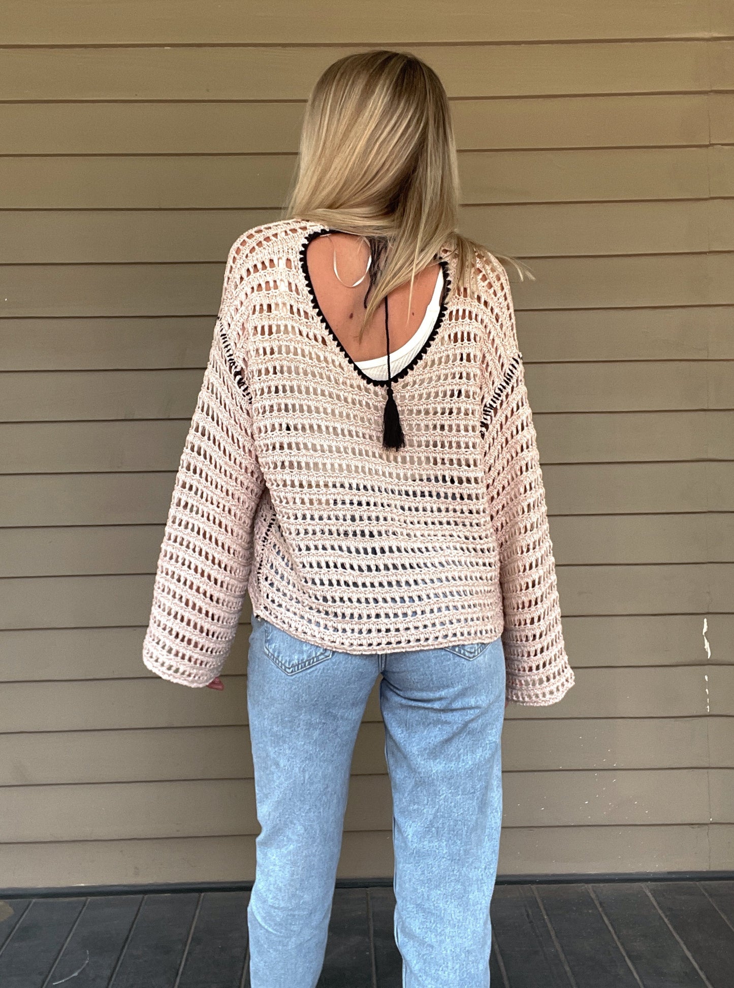 True Romance Open Knit Sweater - Taupe Open Knit Sweater Tie Back Crochet Top 53% Acrylic, 47% Nylon Color: Taupe Look stylish and feel relaxed with this taupe True Romance Open Knit Sweater. Crafted with a delicate crochet top, this sweater is the perfect piece to keep you comfortable and fashionable. The classic design makes it easy to pair with any outfit for a stunning look.