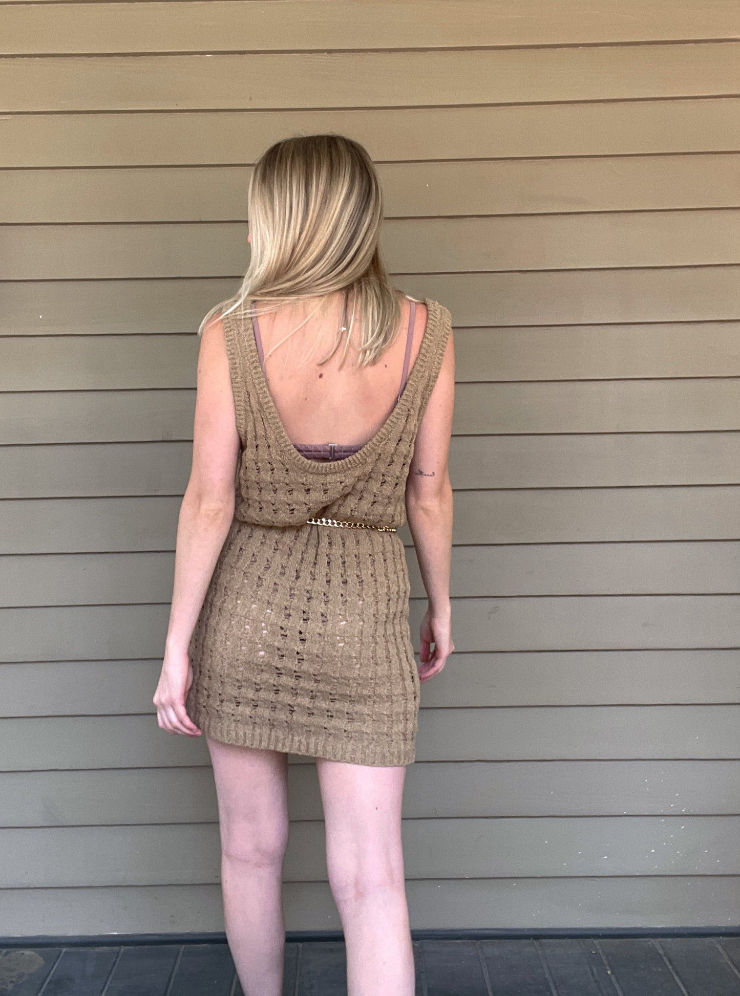 By The Sea Crochet Mini Dress Crochet Knitted Dress 67% Acrylic, 33% Nylon Color: Mocha The By The Sea Crochet Mini Dress is perfect to layer on over your favorite bikini. Crafted with lightweight, breathable crochet, this dress is perfect for hot days in the sun. Effortlessly throw it on for a day in the sand or a night out.