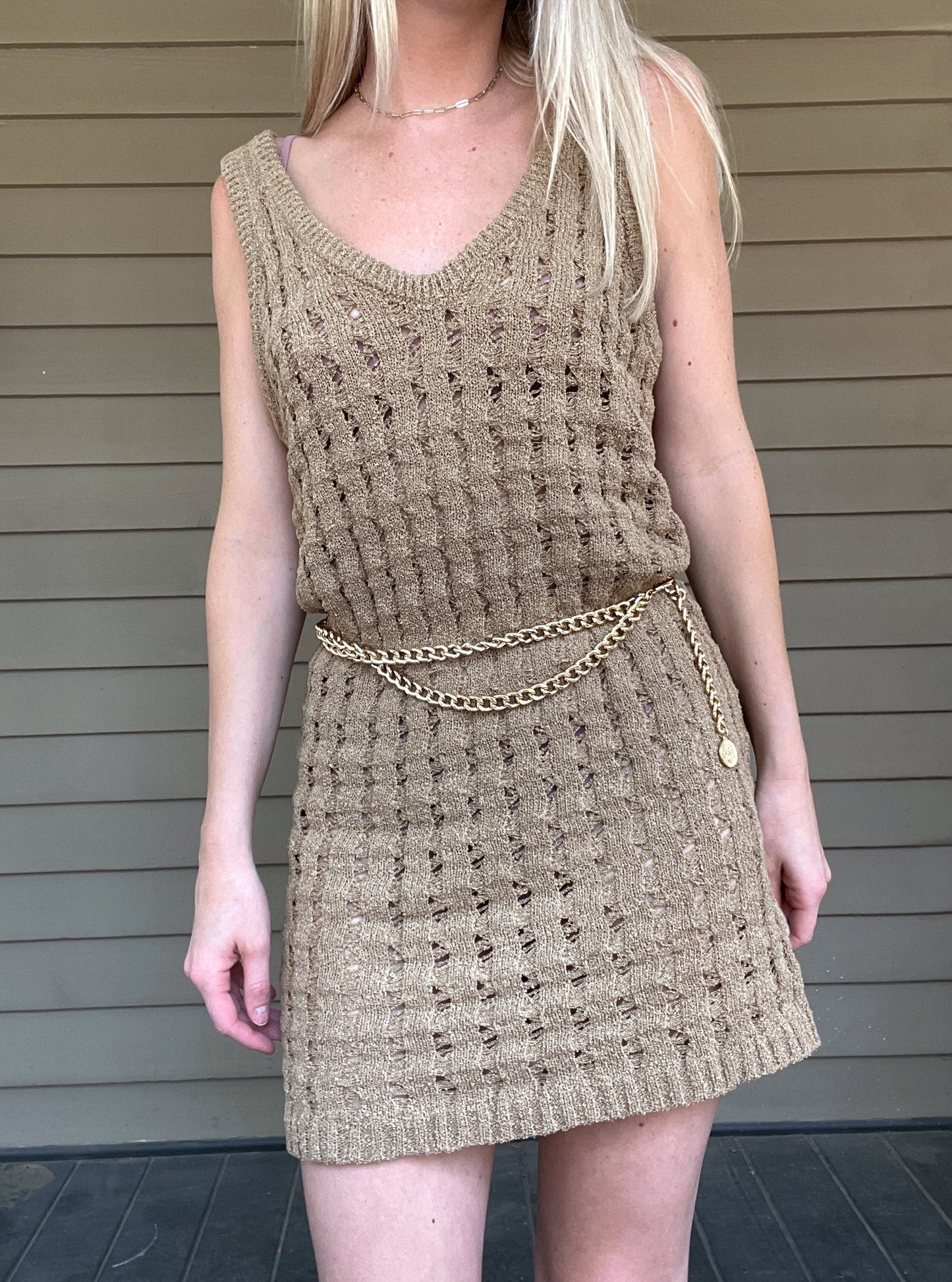 By The Sea Crochet Mini Dress Crochet Knitted Dress 67% Acrylic, 33% Nylon Color: Mocha The By The Sea Crochet Mini Dress is perfect to layer on over your favorite bikini. Crafted with lightweight, breathable crochet, this dress is perfect for hot days in the sun. Effortlessly throw it on for a day in the sand or a night out.