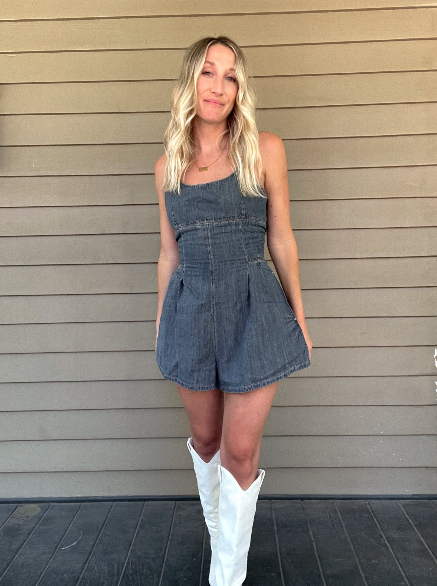 Western Washed Denim Romper Denim Romper Zipper Pockets 100% Cotton String detailed back Color: Washed Denim This Western Washed Denim Romper will have you feeling stylish and comfortable. Made of premium denim, it provides a snug fit and is designed for easy movement. Enjoy taking on the day in this fashionable romper.