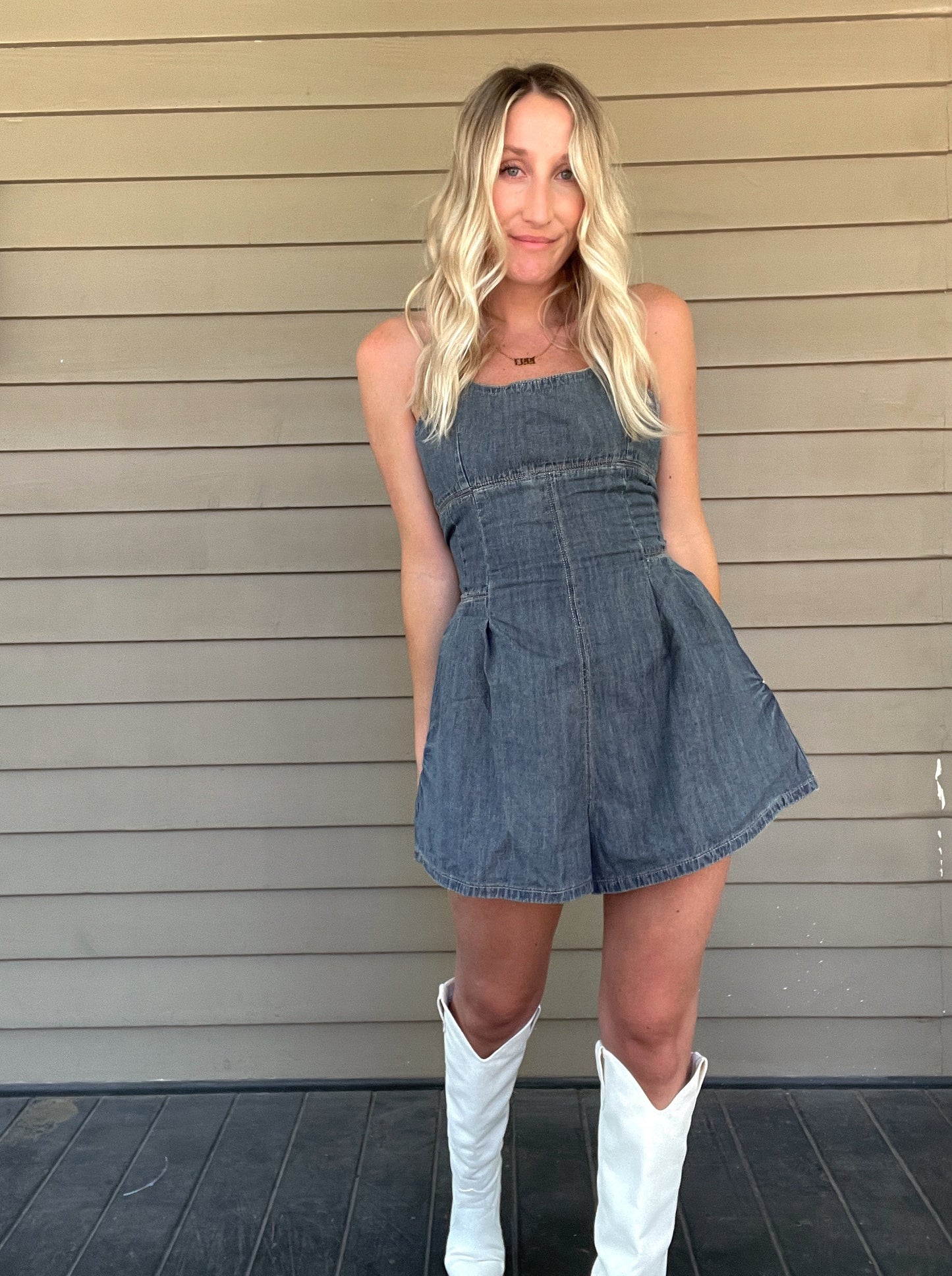 Western Washed Denim Romper Denim Romper Zipper Pockets 100% Cotton String detailed back Color: Washed Denim This Western Washed Denim Romper will have you feeling stylish and comfortable. Made of premium denim, it provides a snug fit and is designed for easy movement. Enjoy taking on the day in this fashionable romper.