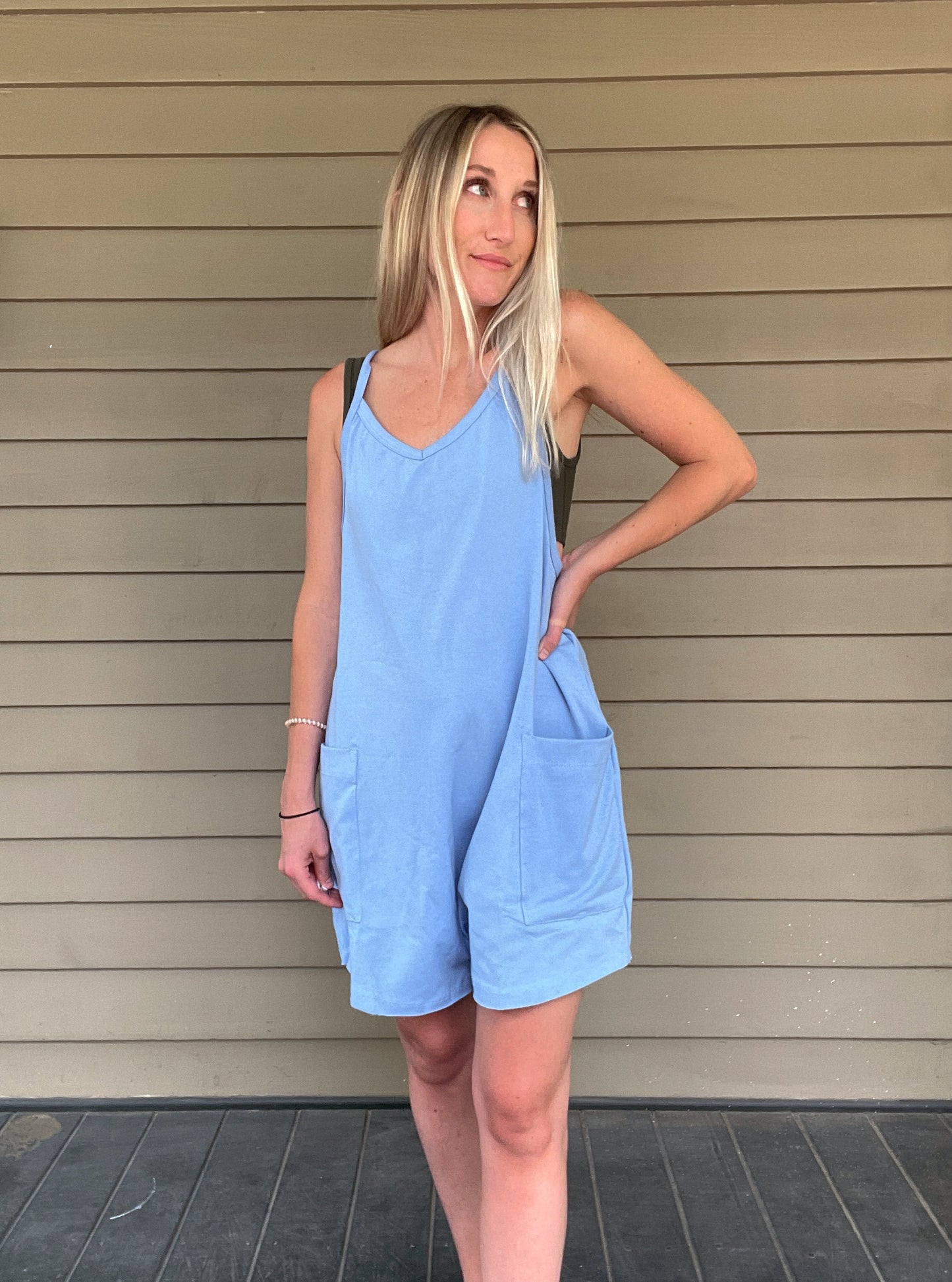 Cozy Up Tank Romper - Blue Oversize Tank V-neck Solid Jersey Romper Effortless and oversized silhouette Racerback Oversized patch pockets Dropped armholes Soft and comfy onesie features a slouchy 95% Cotton, 5% Spandex Color: Blue