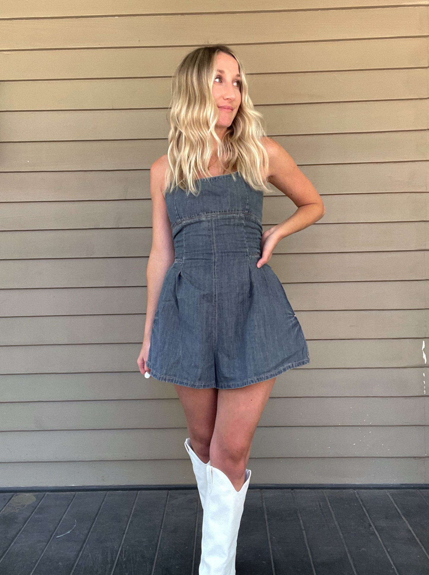 Western Washed Denim Romper Denim Romper Zipper Pockets 100% Cotton String detailed back Color: Washed Denim This Western Washed Denim Romper will have you feeling stylish and comfortable. Made of premium denim, it provides a snug fit and is designed for easy movement. Enjoy taking on the day in this fashionable romper.