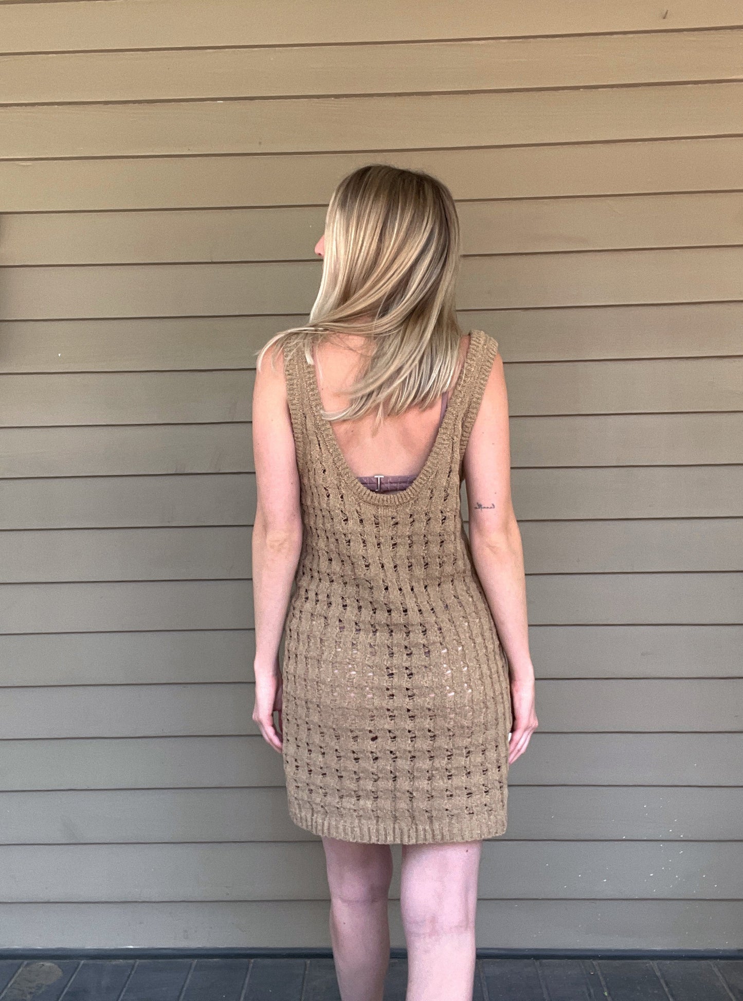 By The Sea Crochet Mini Dress Crochet Knitted Dress 67% Acrylic, 33% Nylon Color: Mocha The By The Sea Crochet Mini Dress is perfect to layer on over your favorite bikini. Crafted with lightweight, breathable crochet, this dress is perfect for hot days in the sun. Effortlessly throw it on for a day in the sand or a night out.