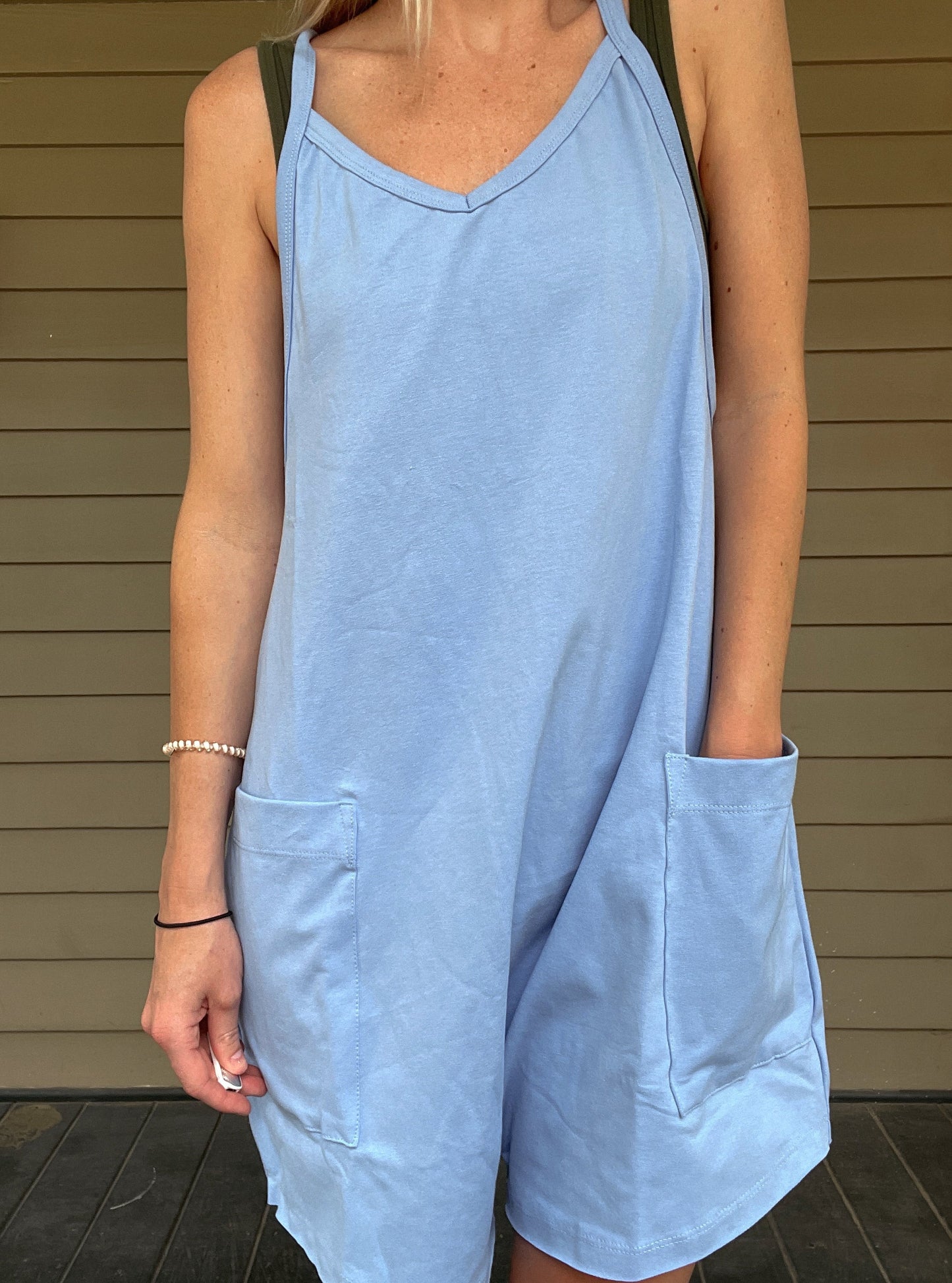 Cozy Up Tank Romper - Blue Oversize Tank V-neck Solid Jersey Romper Effortless and oversized silhouette Racerback Oversized patch pockets Dropped armholes Soft and comfy onesie features a slouchy 95% Cotton, 5% Spandex Color: Blue