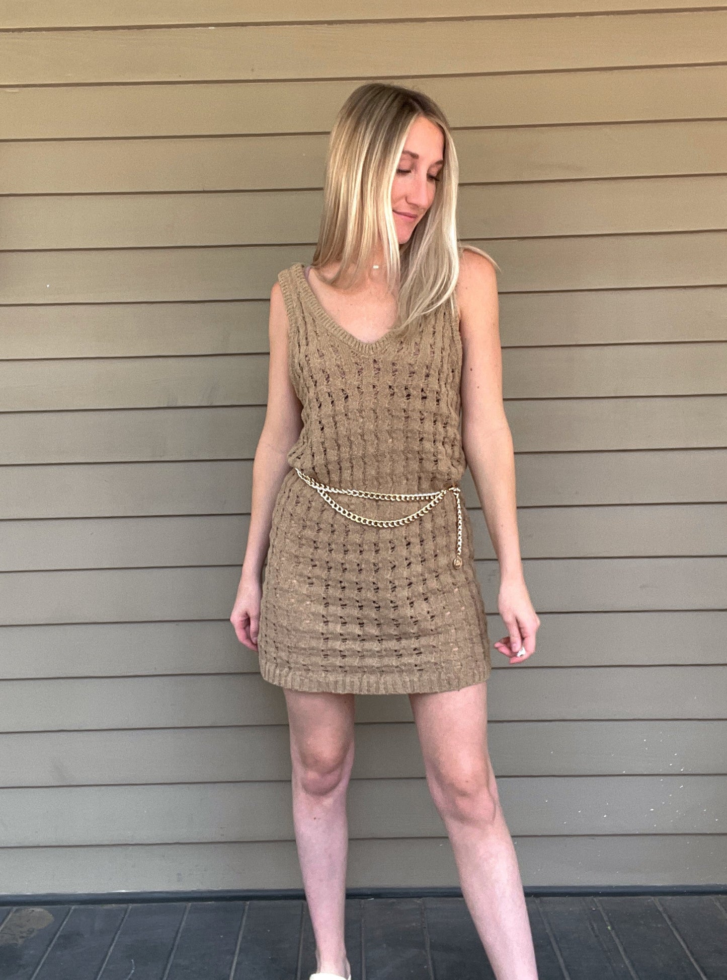 By The Sea Crochet Mini Dress Crochet Knitted Dress 67% Acrylic, 33% Nylon Color: Mocha The By The Sea Crochet Mini Dress is perfect to layer on over your favorite bikini. Crafted with lightweight, breathable crochet, this dress is perfect for hot days in the sun. Effortlessly throw it on for a day in the sand or a night out.