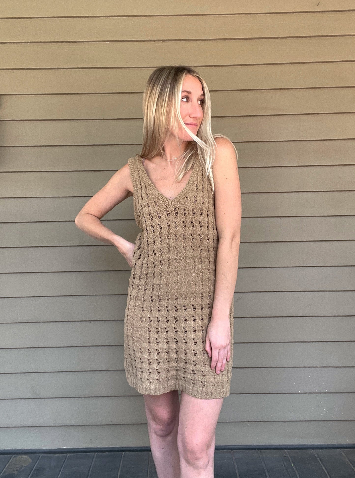 By The Sea Crochet Mini Dress Crochet Knitted Dress 67% Acrylic, 33% Nylon Color: Mocha The By The Sea Crochet Mini Dress is perfect to layer on over your favorite bikini. Crafted with lightweight, breathable crochet, this dress is perfect for hot days in the sun. Effortlessly throw it on for a day in the sand or a night out.