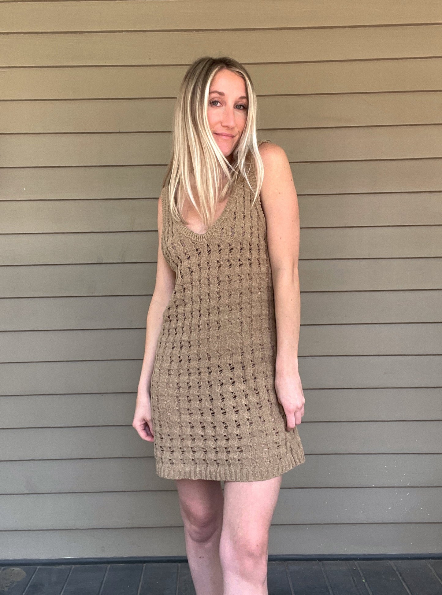 By The Sea Crochet Mini Dress Crochet Knitted Dress 67% Acrylic, 33% Nylon Color: Mocha The By The Sea Crochet Mini Dress is perfect to layer on over your favorite bikini. Crafted with lightweight, breathable crochet, this dress is perfect for hot days in the sun. Effortlessly throw it on for a day in the sand or a night out.