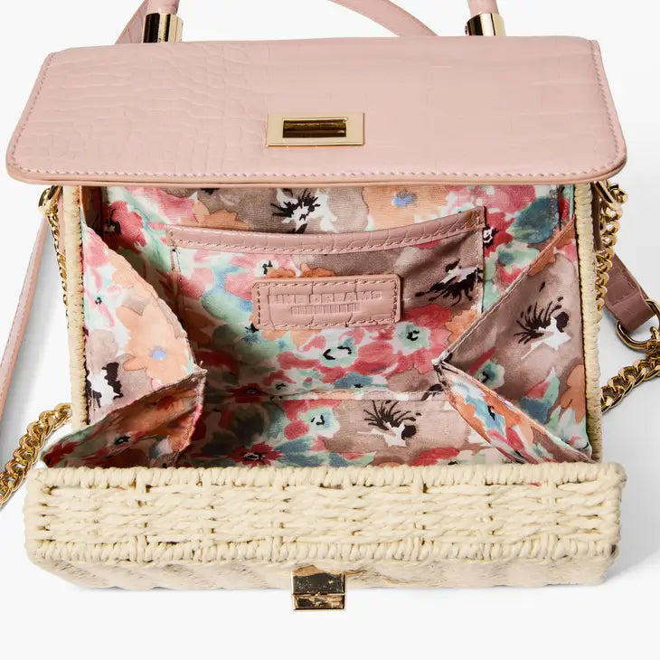 A chic mini satchel shoulder purse composed of a sturdy woven straw body. Also incorporates faux croc vegan leather detailing on the front flap and structured single top handle.