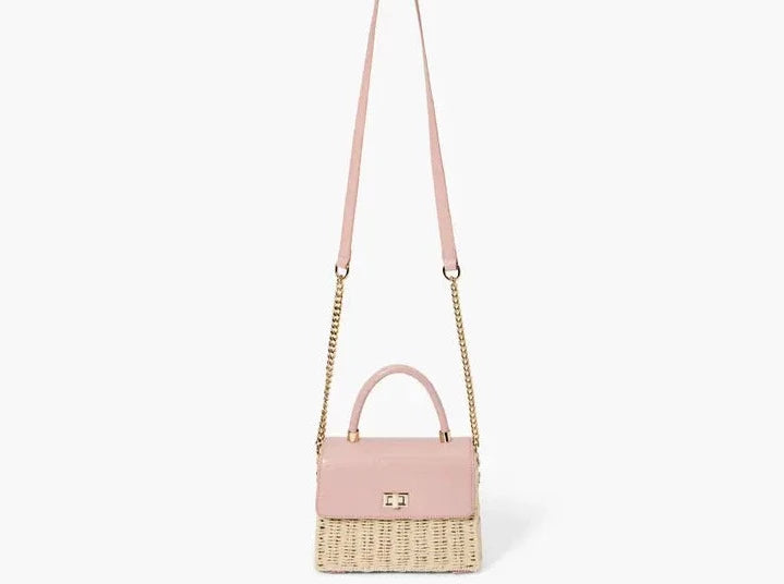 A chic mini satchel shoulder purse composed of a sturdy woven straw body. Also incorporates faux croc vegan leather detailing on the front flap and structured single top handle.