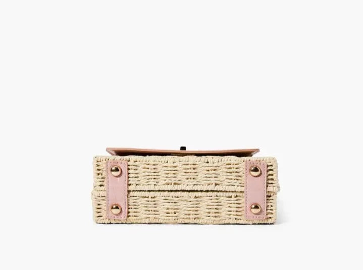 A chic mini satchel shoulder purse composed of a sturdy woven straw body. Also incorporates faux croc vegan leather detailing on the front flap and structured single top handle.