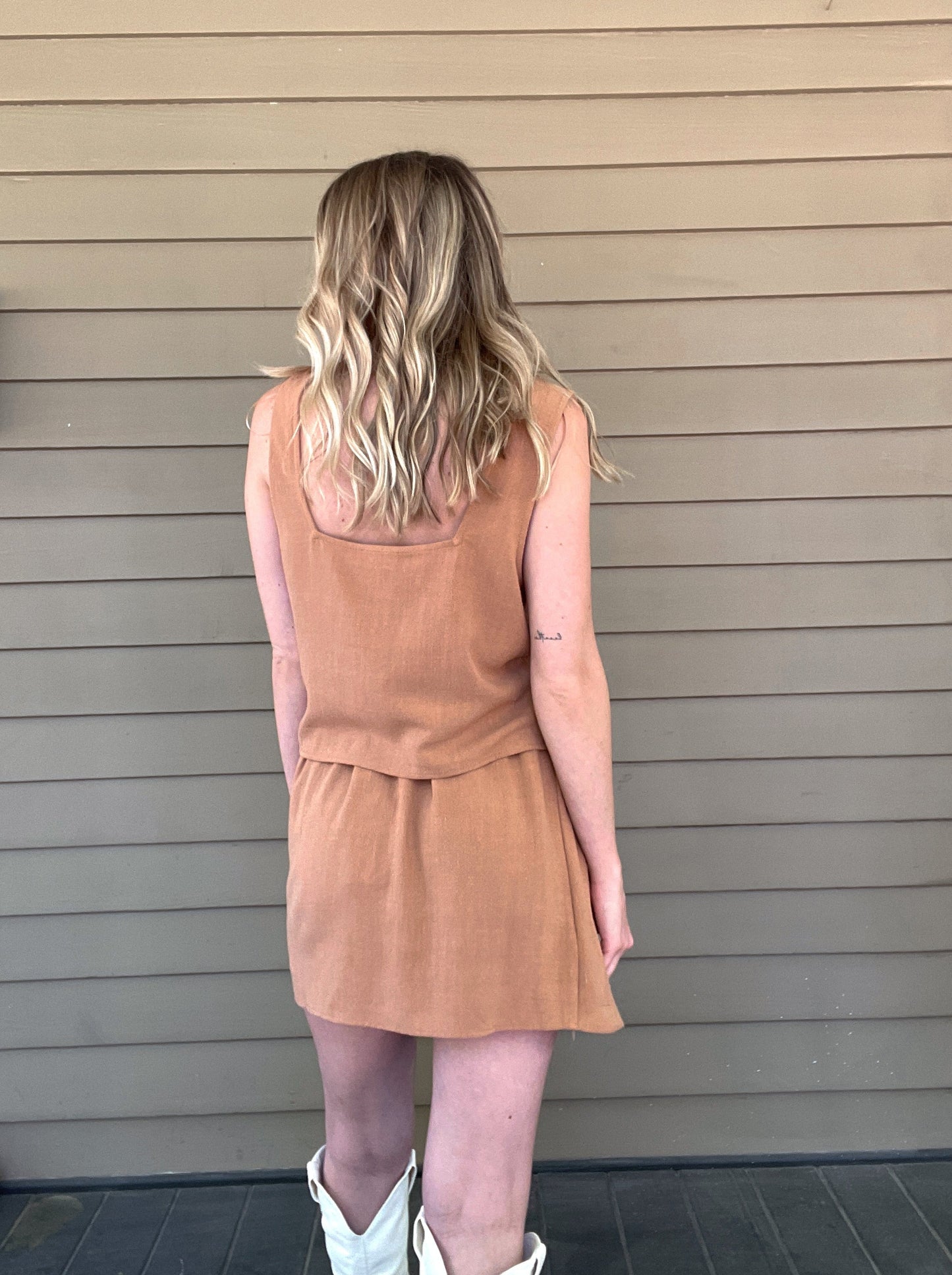 Out West Tank Top and Skirt Set Tank top and skirt set Loose tank top Side button details on skirt Mini skirt 70% Rayon, 30% Linen Color: Tan