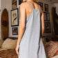 On The Go Jersey Dress  Dress with built in romper V-Neck Sleeveless Racer back Side patched pockets Built-in romper for comfort & protection Zipper Pockets 95% Cotton, 5% Spandex Color: Heather Grey and Kelly Green This stylish On The Go Jersey Dress features a built-in romper perfect for busy days out and about. Built to move with you, its lightweight fabric and built-in shorts provide all-day comfort and support. Enjoy the convenience of an effortless one-piece look without compromising style.