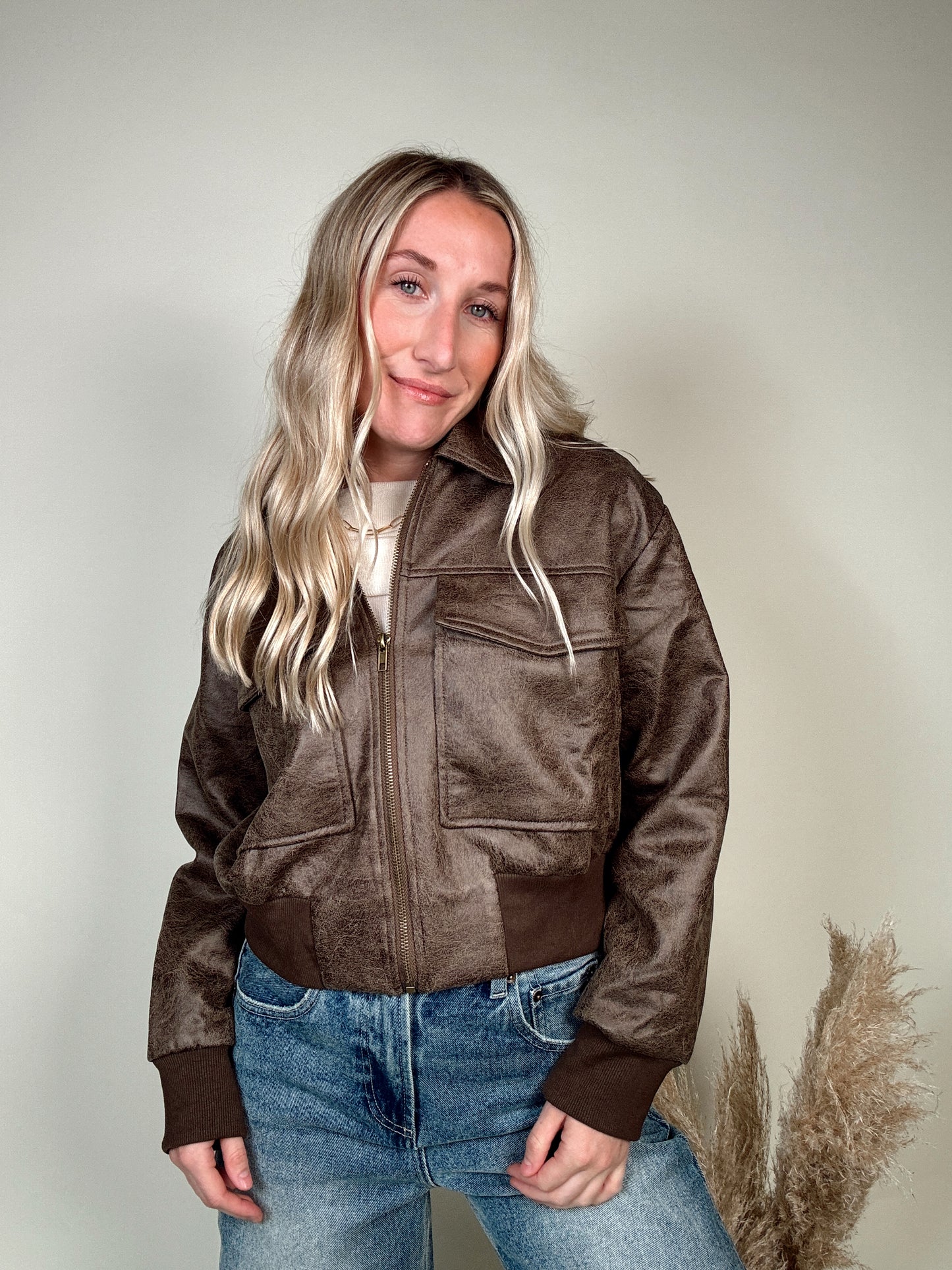 We The Free Sundown Leather Aviator Jacket. The jacket you’ll be wearing now and forever from our We The Free collection, featured in an oversized, aviator-inspired silhouette with a cozy collar and ribbed knit trim.