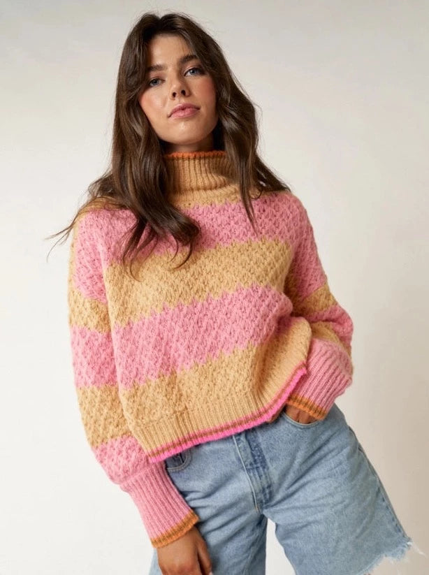 Mandy Multi Stripe High Neck Sweater Top  Multi stripe High neck Chunky Sweater Top Mock Neckline Color: Pink/Yellow This trendy and stylish Mandy Multi Stripe High Neck Sweater Top is designed with a mock neck stripe pattern in a lightweight fabric perfect for any season. With its form-flattering shape and cozy feel, this eye-catching sweater will add a stylish touch to any outfit.