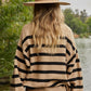 Greta Striped Sweater  Knit Sweater Crew Neck 70% Polyester, 27% Recycled Polyester, 3% Spandex Color: Mocha Stay warm and stylish with the Greta Striped Sweater. Crafted from cozy material, this sweater features bold stripes for a classic look. Perfect for any occasion, the Greta Sweater is sure to become a favorite.