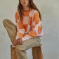 Call You Mine Pullover  Knit Polyester Sweater Gingham Print Crew Neck Long Sleeve Pullover Top 100% Polyester Color: Orange This Call You Mine Pullover features a timeless checkered print design. Crafted with quality materials and stitching, this cardigan is sure to deliver comfort and style for years to come. Add a classic touch to your wardrobe with this stylish cardigan.