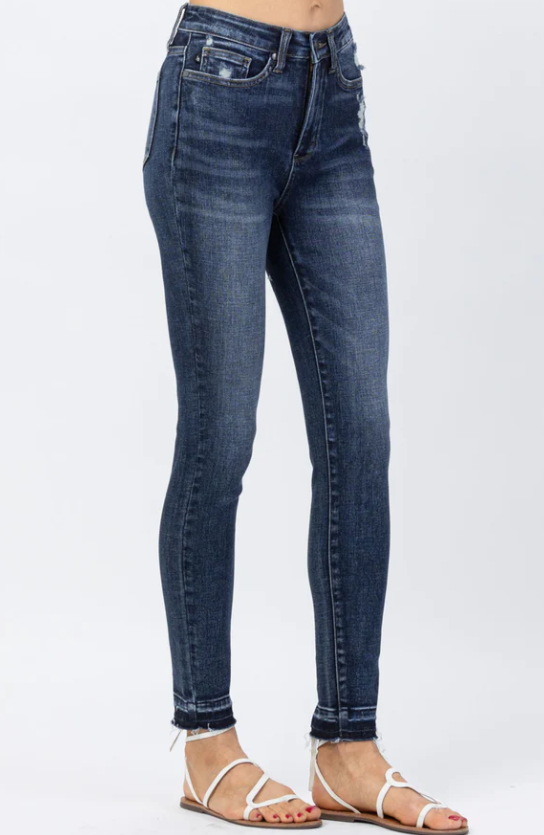 High Waist Tummy Control Skinny Jeans - Judy Blue  Skinny Jeans Release Hem High Waist Tummy Control Panel Size down 1 size FRONT RISE: 10.75" INSEAM: 28.5" 93% Cotton, 6% Polyester, 1% Spandex Color: Blue These High Waist Tummy Control Skinny Jeans from Judy Blue will help you look slimmer and smoother without sacrificing comfort. Crafted with a special tummy control panel, they offer superior support and a flattering fit. With these jeans, you'll feel comfortable while looking your best.