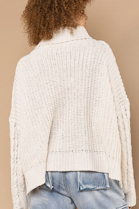 Turtle Neck Cable Knit Sweater Designed in an oversize body Turtle neck long sleeve in chenille with cable knitting Pullover sweater Specs/dimensions: - Bust: 30" - Length: 20-1/2" - Sleeve: 17-1/2" - Shoulder: 29-1/2" 100% Polyester Color: Powder Cream
