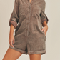 Get Like This Washed Corduroy Romper  Corduroy Romper Long Sleeves  Buttons Pockets 100% Cotton Color: Washed Brown This Get Like This Washed Corduroy Romper is an ideal addition to your wardrobe. Crafted from pure corduroy, it is lightweight and breathable, ensuring comfort and style all day. This romper is perfect for fall.