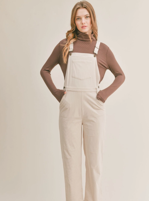 Nomad Corduroy Overalls  Corduroy overalls Pockets 100% Polyester Color: Cream The Nomad Corduroy Overalls will keep you stylish and comfortable all day long. Made from a durable corduroy fabric, these overalls are perfect for everyday wear. They provide a great combination of both breathability and protection from the elements. With a timeless silhouette, they are sure to become a staple in your wardrobe.