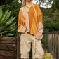 Lace Up Color Block Knit Top  Designed in drawstring lace up with hood Long sleeves Oversize fit Out seam detailing Color blocked vintage wash knit panels Floral pattern quilted knit top