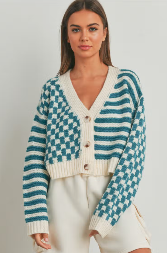 Cheeky Checkered Stripe Cardigan  Oversized button down Checkered and stripe design Cardigan 100% Acrylic Color: Multiple This cozy cardigan features a stylish checkered and stripe design. Its unique pattern is sure to bring an element of fun and vibrancy to any ensemble. Crafted with comfort in mind, this cardigan will be an instant favorite.