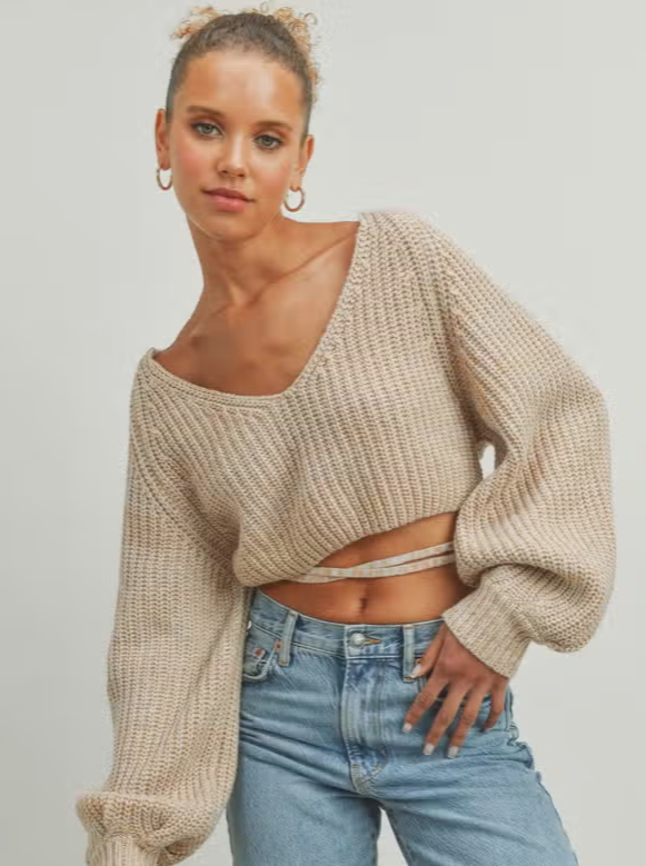 Sadie Strap Sweater  Strap Detail Cropped Sweater Open back 100% Acrylic Color: Latte Strap Detail Open Back Sweater – the epitome of chic and contemporary fashion. This sweater beautifully combines style and elegance with a daring twist.