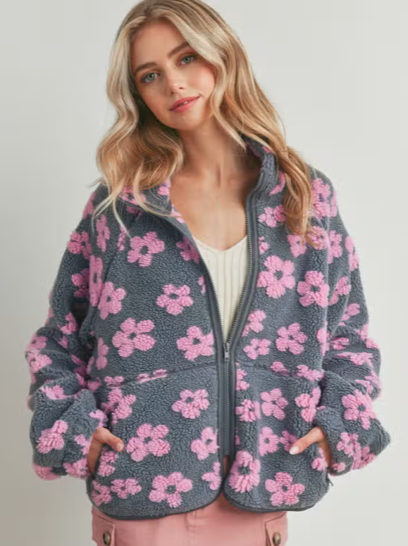 Daisy Flower Fleece Jacket  Zip up jacket Fleece Floral pattern Pockets 100% Polyester Color: Multiple Daisy Flower Pattern Fleece Sherpa - a delightful blend of charm and comfort. This fleece sherpa showcases a cheerful daisy flower pattern, enveloping you in warmth and style.