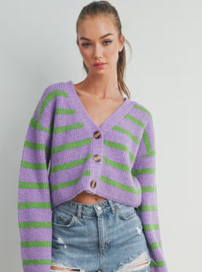Freddy Fall Stripe Cardigan  Button up cardigan Stripe Details 75% Acrylic, 25% Nylon Color: Purple/Green Introducing our captivating Stripe Color Block Crop Cardigan, a versatile and chic addition to your wardrobe. Designed to seamlessly blend comfort, style, and a playful pop of color, this cardigan is a true fashion statement for any season.